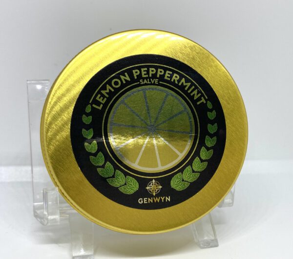 A yellow and black tin with lemon peppermint on it