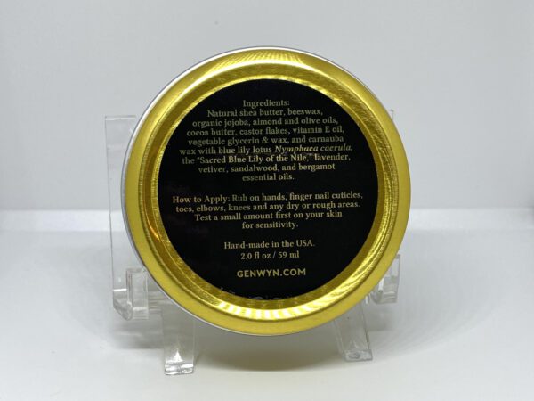 A gold and black label on a clear plastic container.