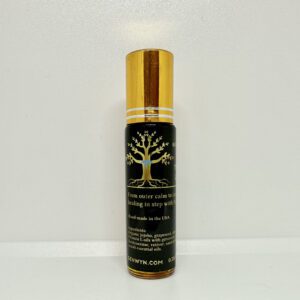 A bottle of oil sitting on top of a table.