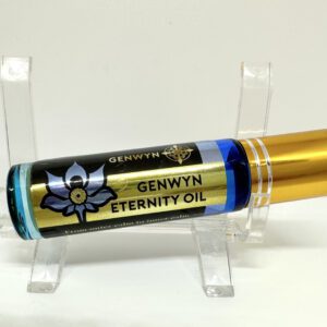 A gold tube of gengwyn eternity oil on top of a stand.